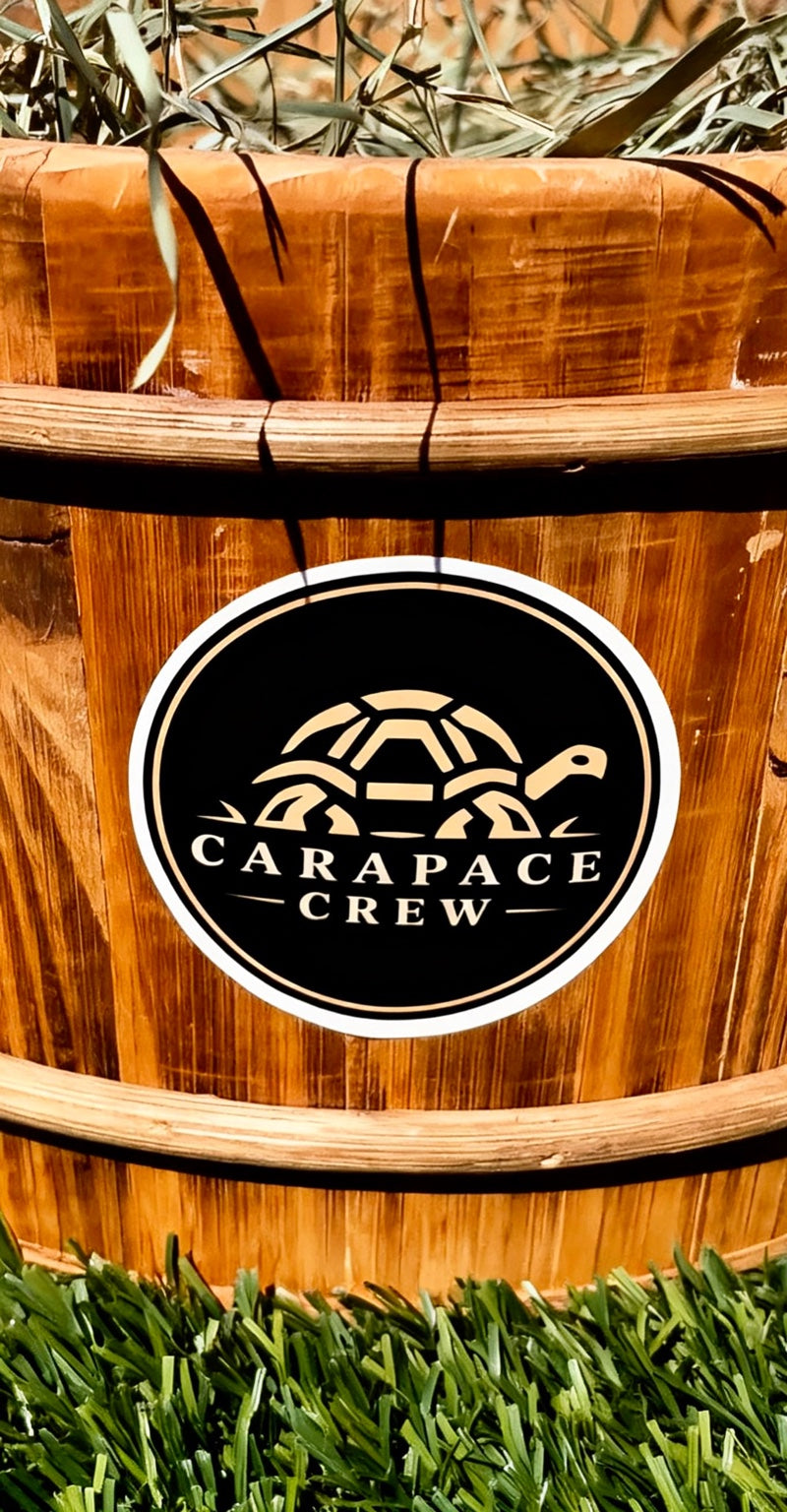 Crew Logo sticker on a wooden planter outdoors